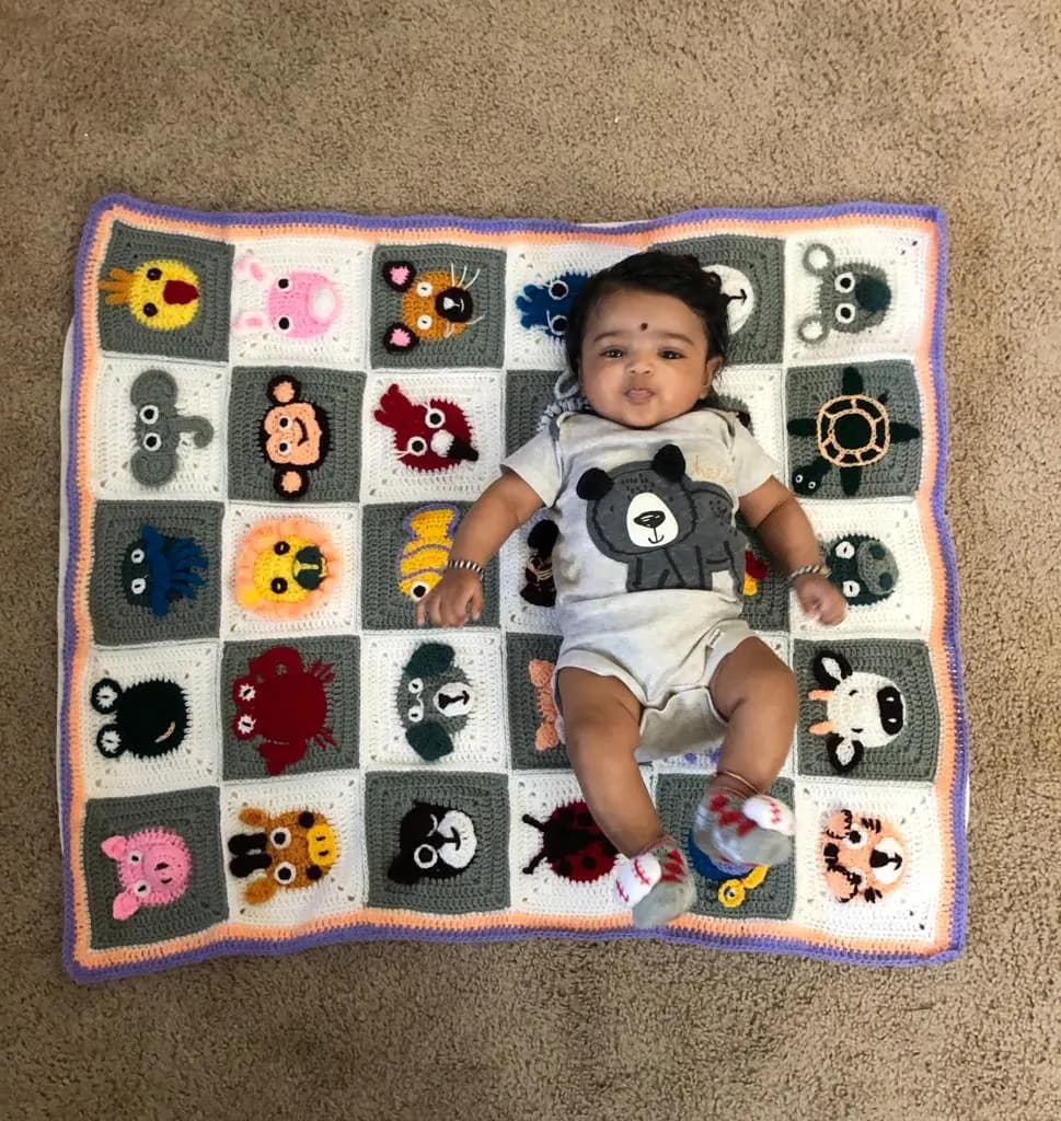 Crochet baby blanket with textured stitch pattern