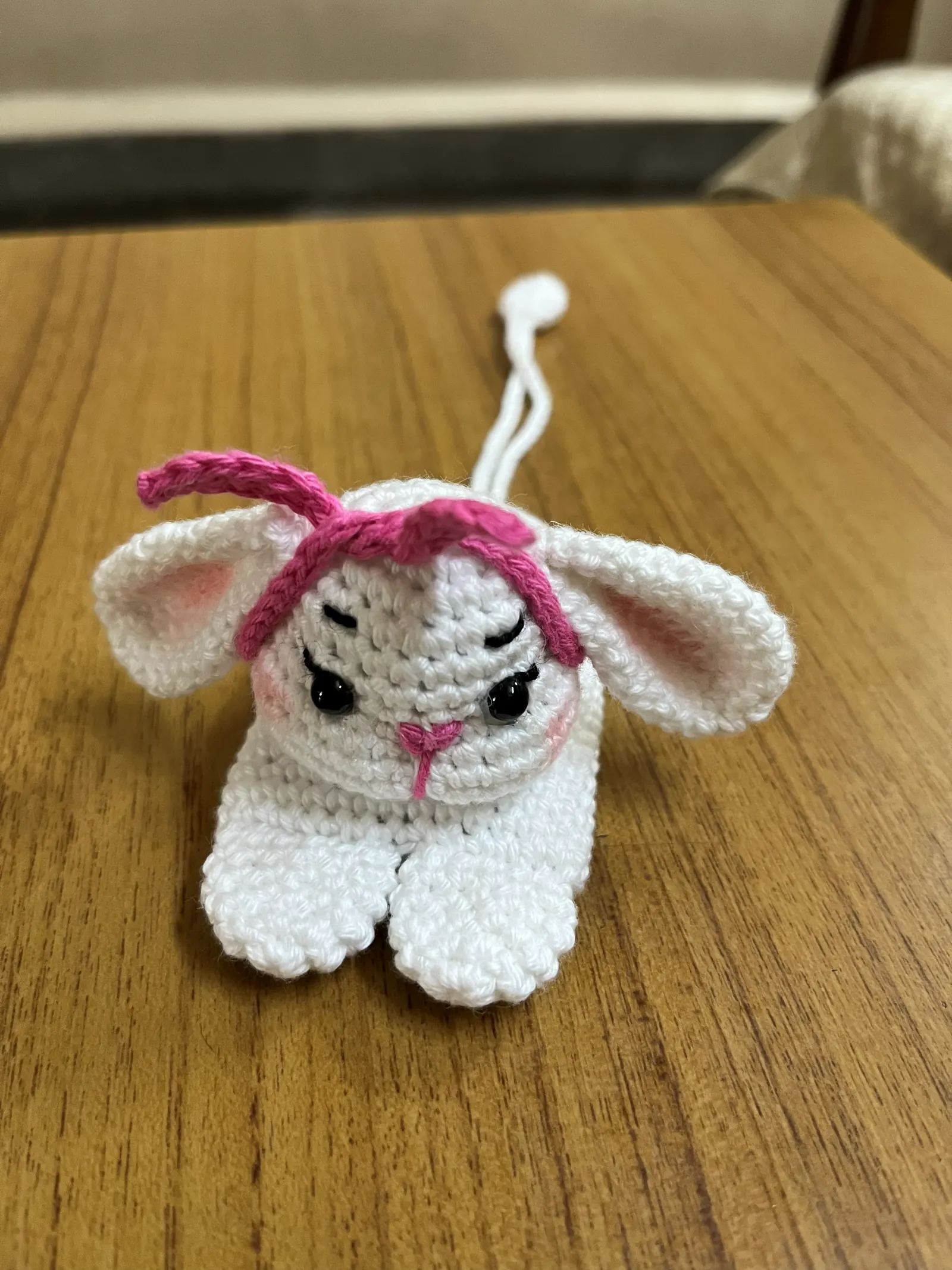 White crochet lamb keychain with pink accents