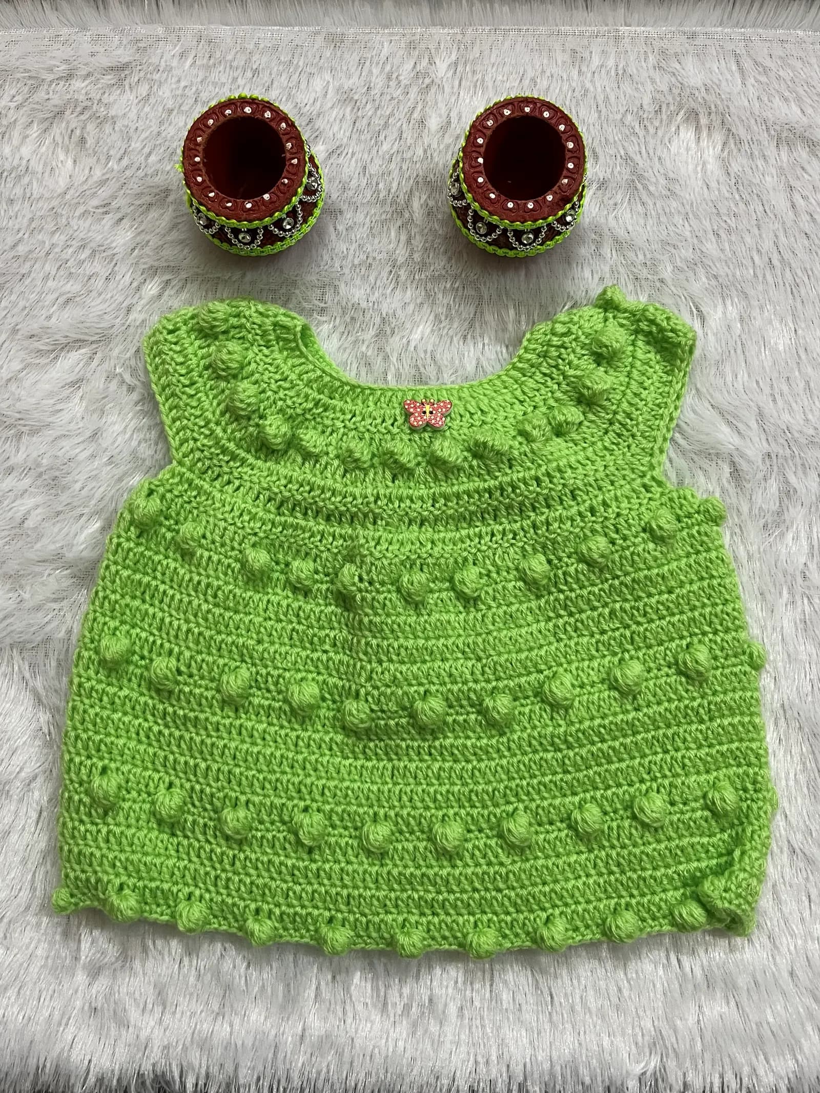 Mint green crochet baby top with bobble stitch