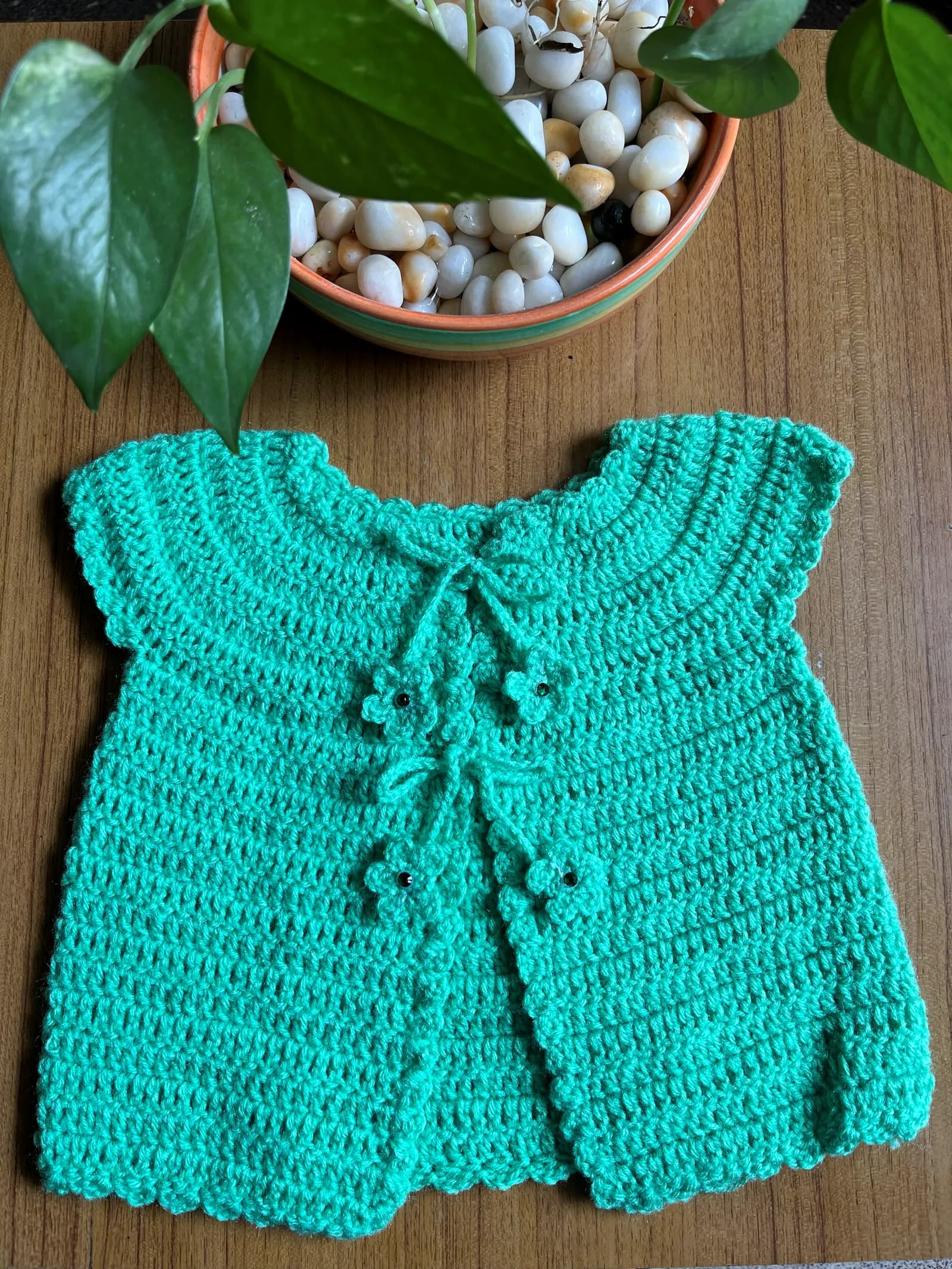 Seafoam green crochet baby cardigan with tie closure