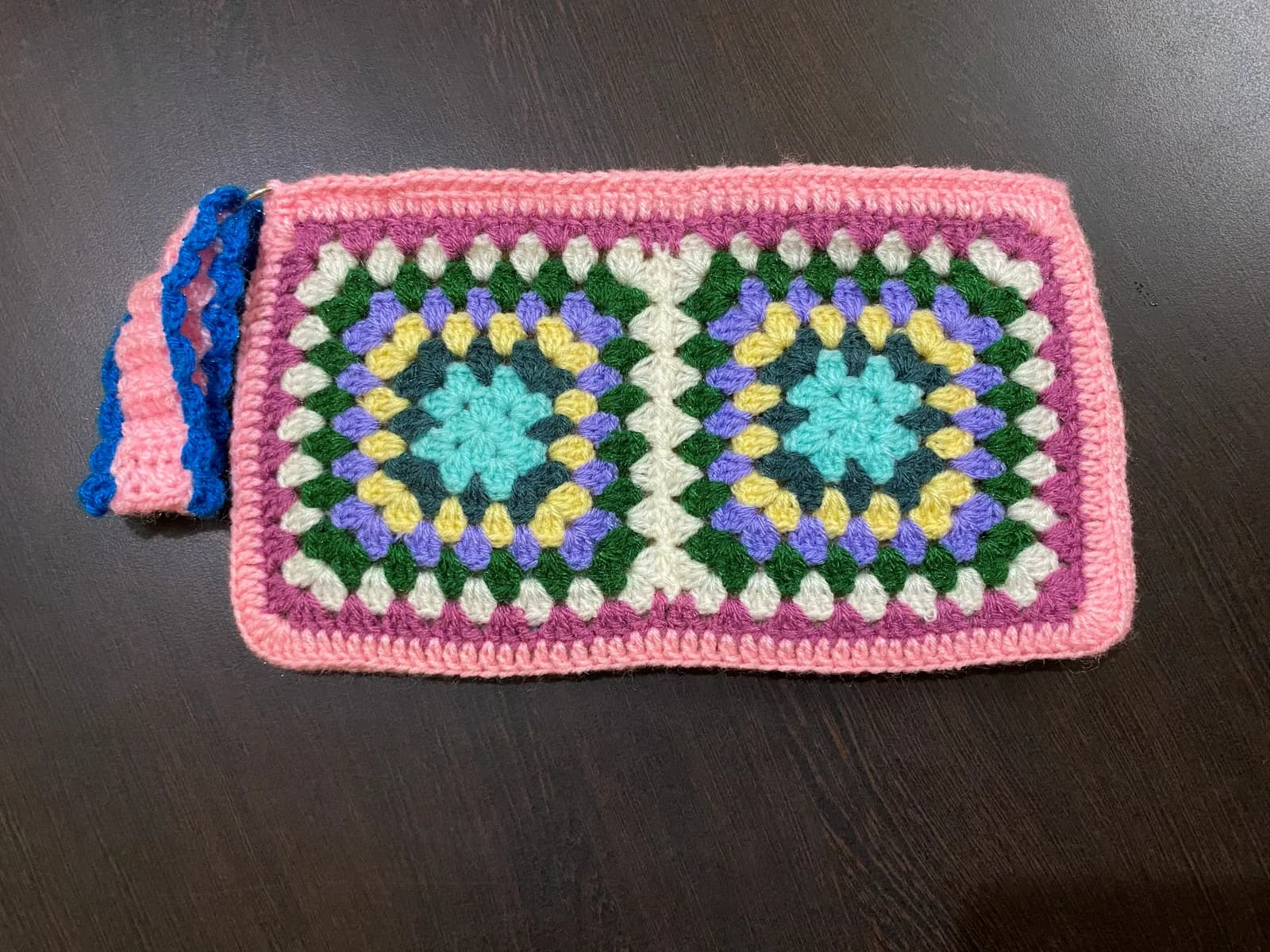 Warm-toned crochet pouch with strap