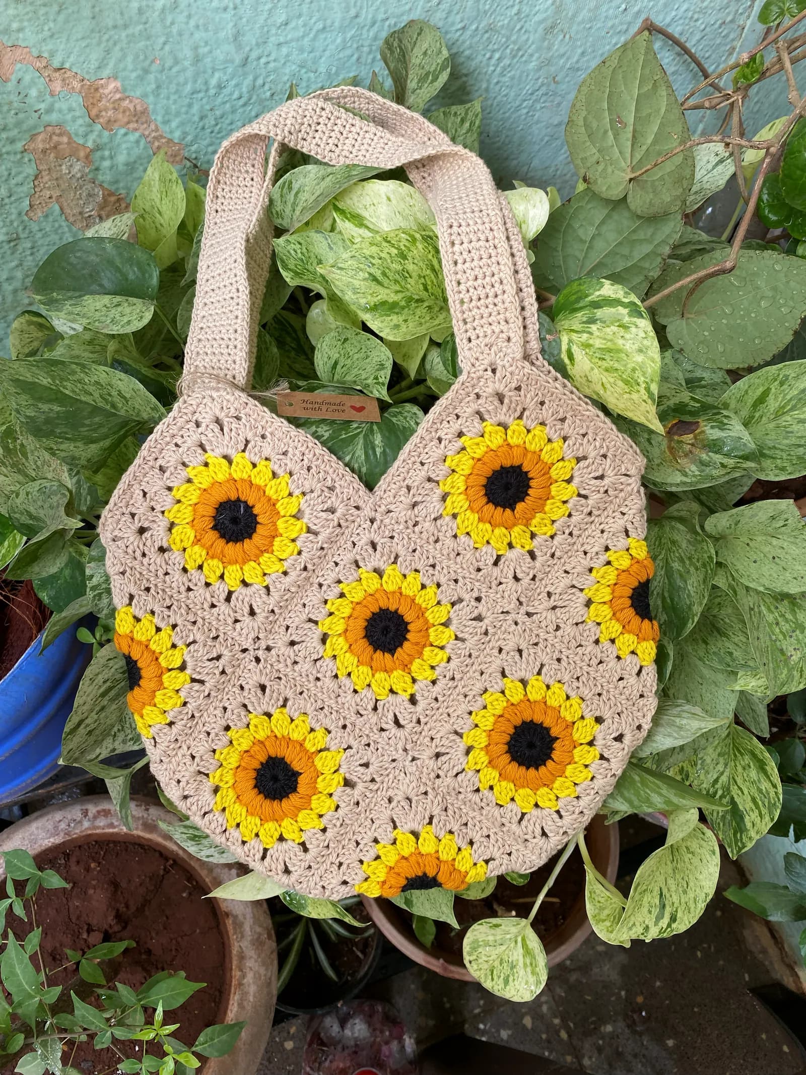 Green crochet sling pouch