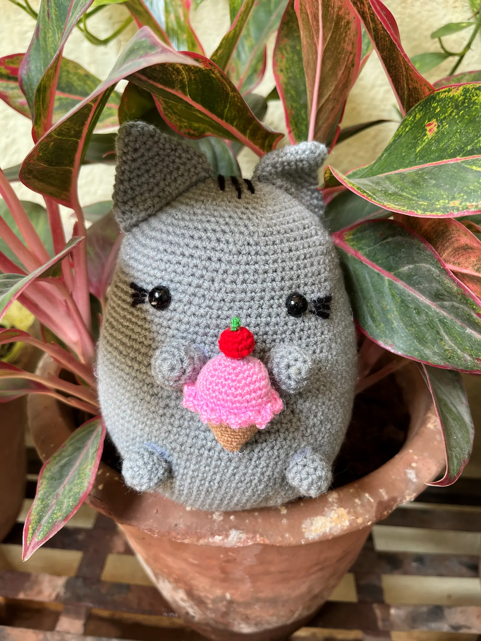 Handmade gray crochet cat toy